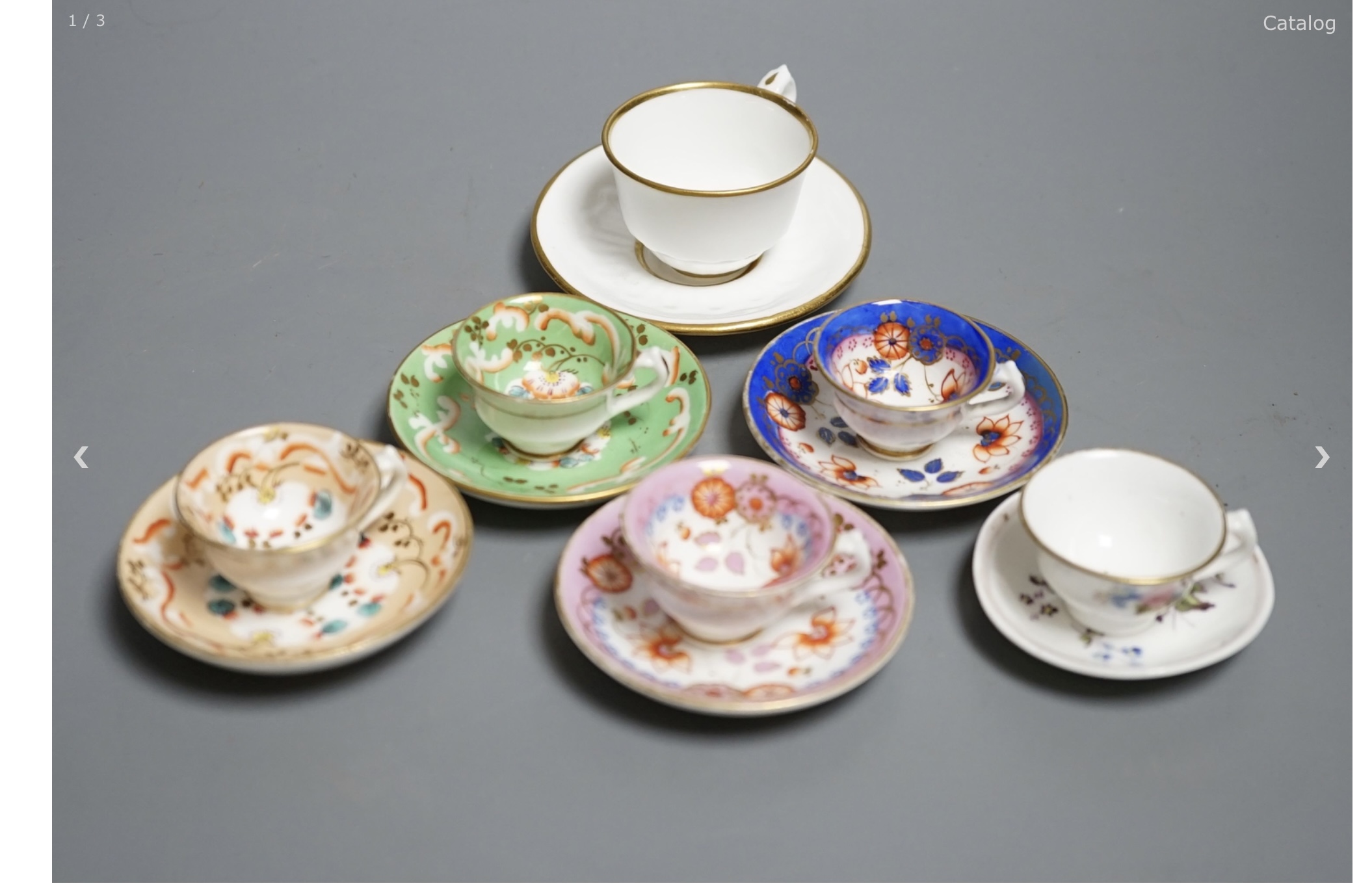 Seven Staffordshire or Alcock miniature teacups and saucers and a similar miniature mug, c.1815-20. Provenance - Mona Sattin collection of miniature cups and saucers, collection no.s 144, 148, 151, 152, 155, 161-163